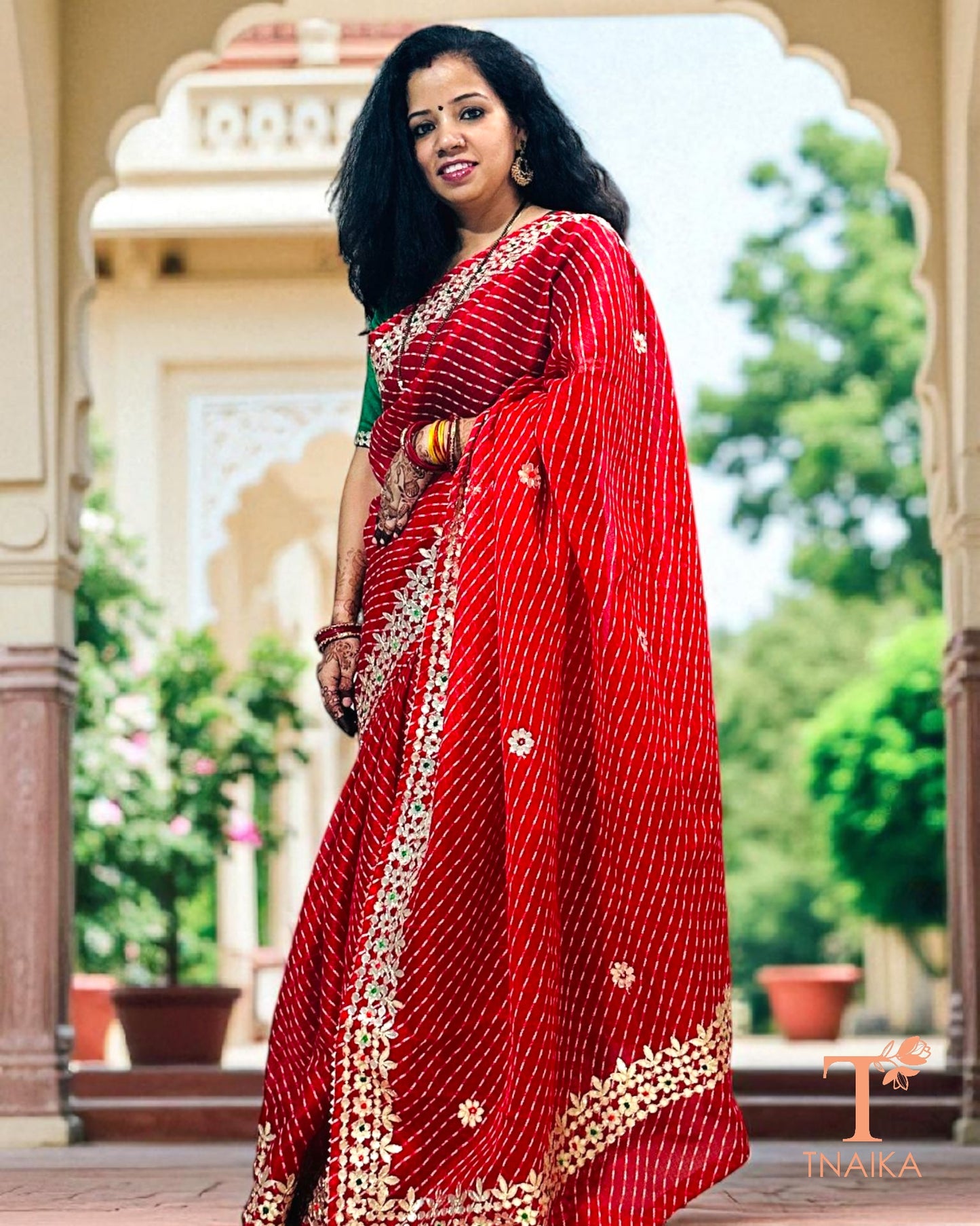 Lightweight Kota Doria saree in vibrant red with exquisite handcrafted Gotta Patti embellishments.