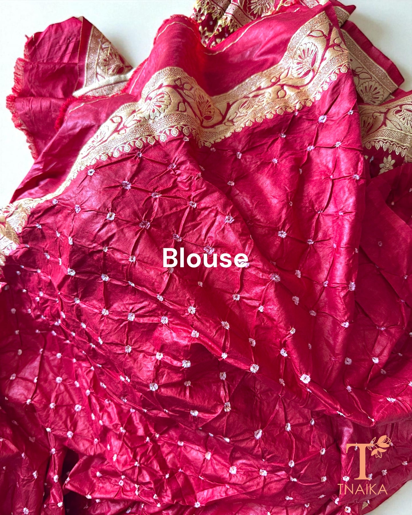 Festive Upada silk saree with Bandhej print and woven zari border.