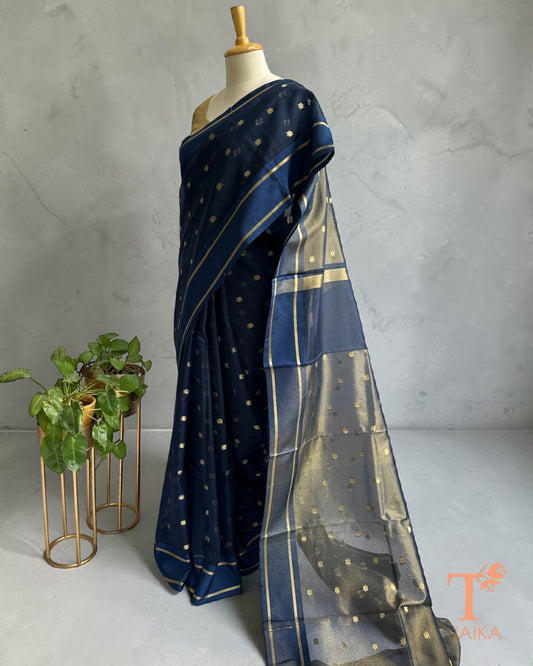 Elegant navy blue organza saree with gold woven border