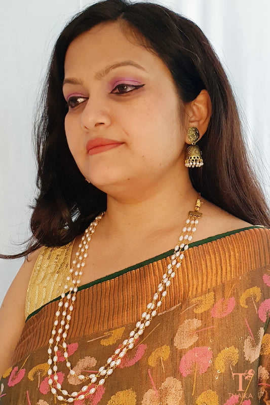 Regal pearl layered mala
Luxury pearl necklace
Vintage pearl layered mala
Multi-strand pearl bridal necklace
Layered pearl jewelry online
Pearl mala with Kundan pendant
Statement pearl layered mala
Handcrafted pearl mala necklace
Ethnic pearl layered necklace
Pearl necklace for wedding wear
Royal pearl layered mala
Pearls and Kundan necklace
Traditional Indian pearl mala
Multi-layer pearl necklace set