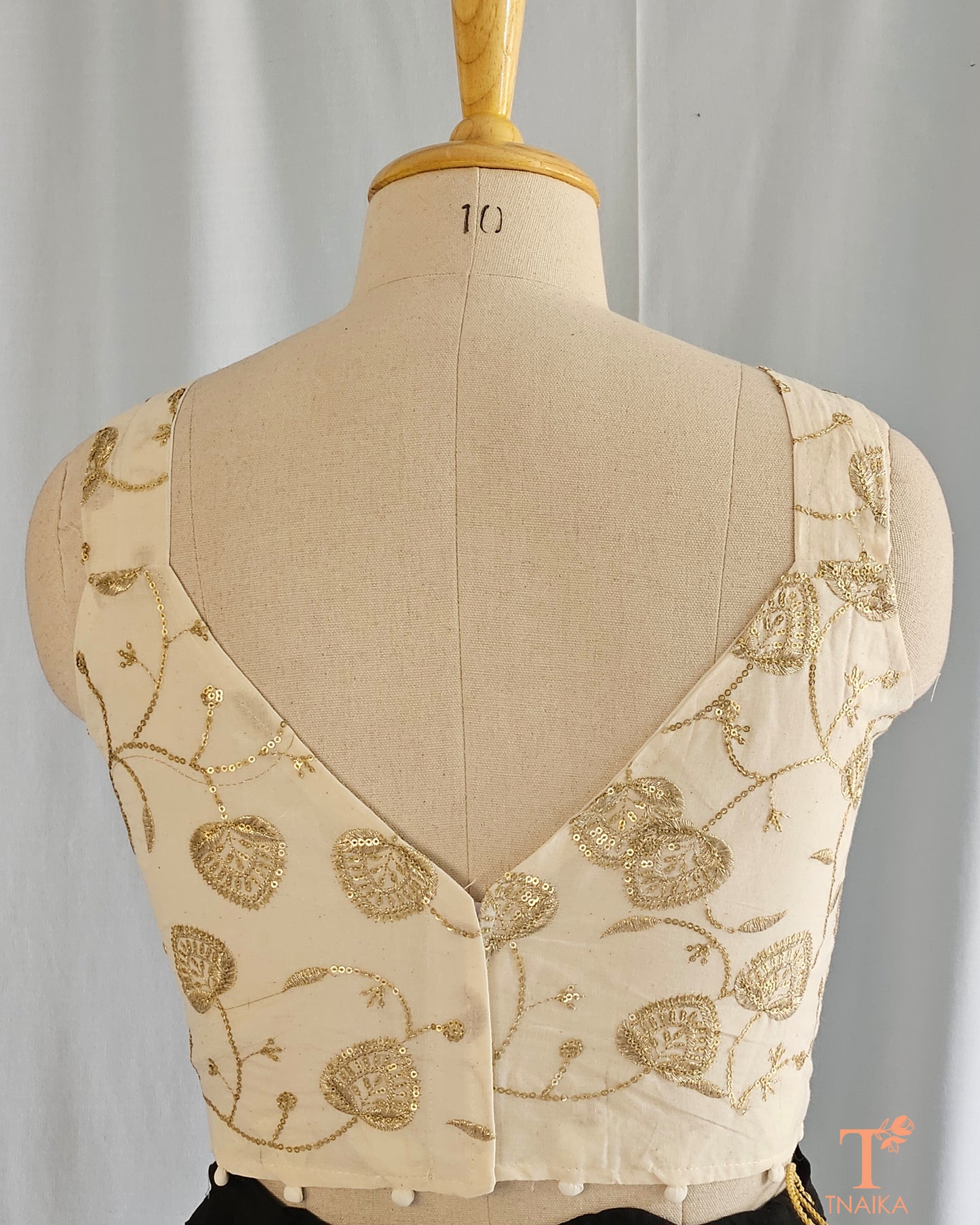 Off-white embroidered blouse
Golden embroidery blouse
Designer blouse with golden thread
Off-white blouse for sarees
Golden work blouse designs
Elegant off-white blouse
Traditional embroidered blouse
Gold thread embroidery blouse
Festive wear blouse designs
Partywear off-white blouse
Bridal blouse with golden embroidery
Lightweight embroidered blouse
Off-white and gold saree blouse
Hand-embroidered golden blouse