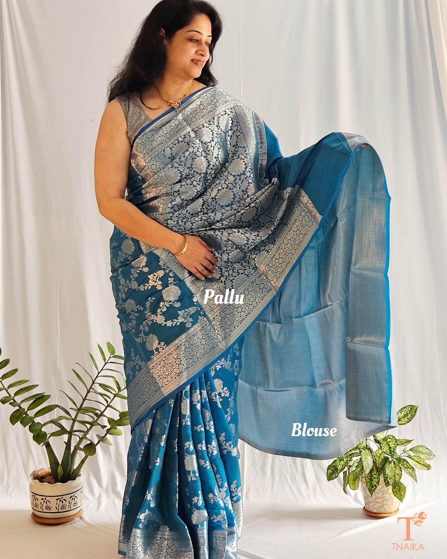 Firozi saree, teal saree, Firozi Banarasi saree, teal blue Banarasi silk saree, semi georgette teal saree, zari woven saree, festive Banarasi saree, lightweight Banarasi saree, wedding saree, party wear silk saree, elegant Banarasi saree, handwoven teal saree, traditional Firozi saree, Indian ethnic wear, rich blue Banarasi saree.