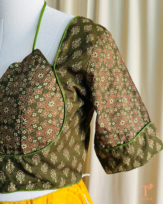 Handcrafted cotton blouse featuring Ajrakh motifs in natural colors