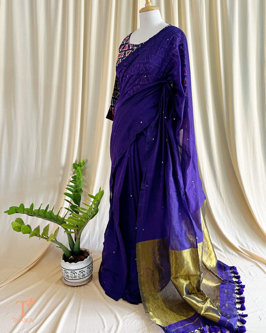 Elegant cotton saree with delicate foil tikki work and golden tissue pallu