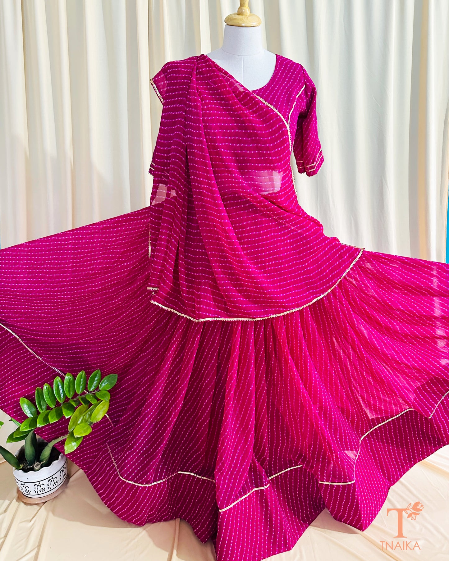 Flowy georgette Leheriya lehenga set with delicate lace work, paired with matching blouse and dupatta