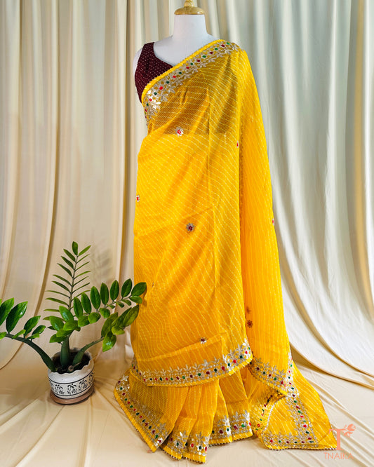 Lightweight Kota Doria saree featuring traditional Leheriya design and festive Gotta Patti detailing