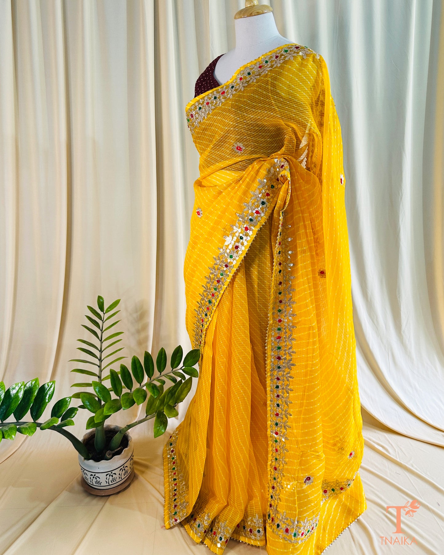 Elegant Leheriya Kota Doria saree paired with a contrast blouse for festive occasions
