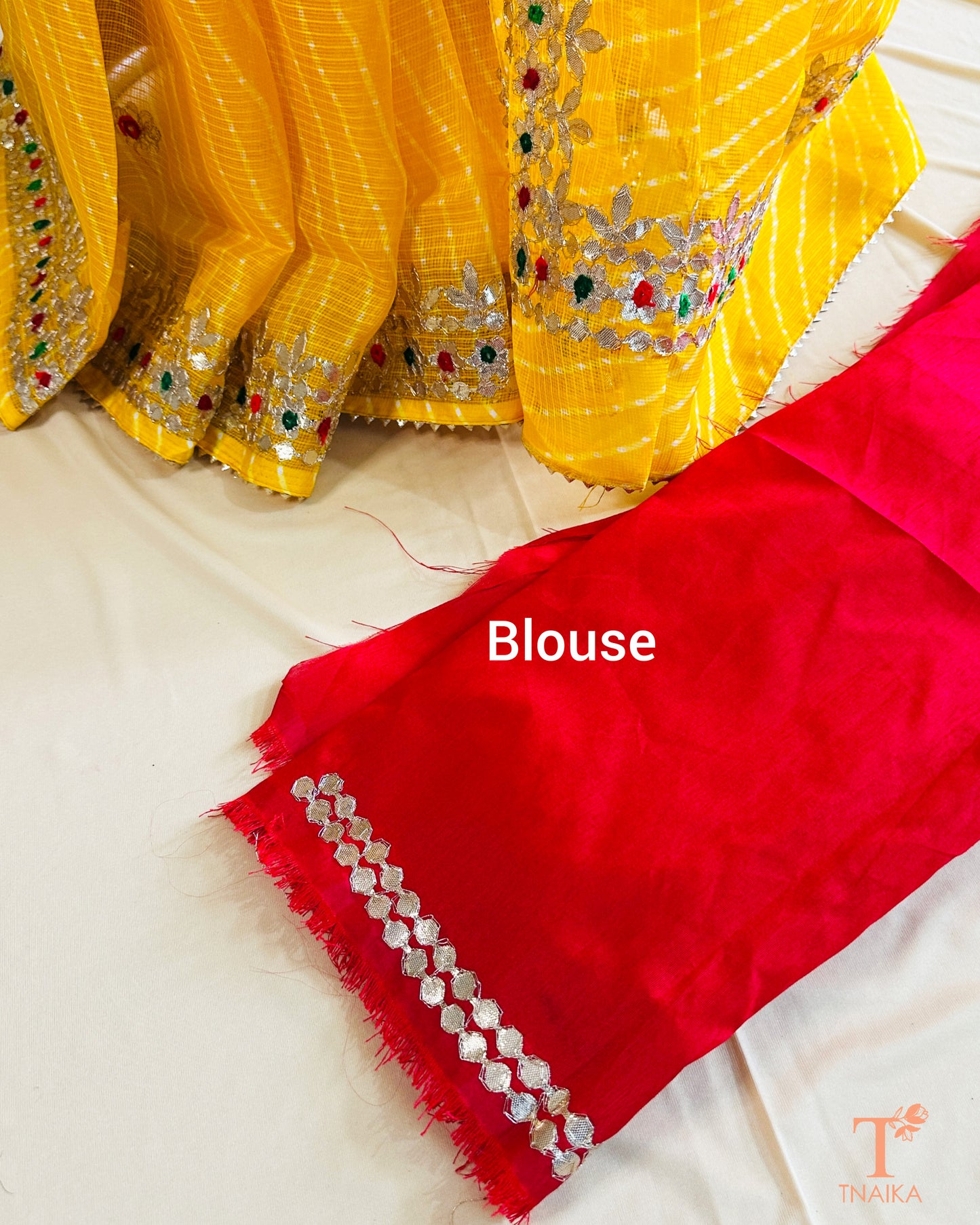 Soft Kota Doria saree with ethnic Leheriya stripes and handcrafted Gotta Patti embellishment