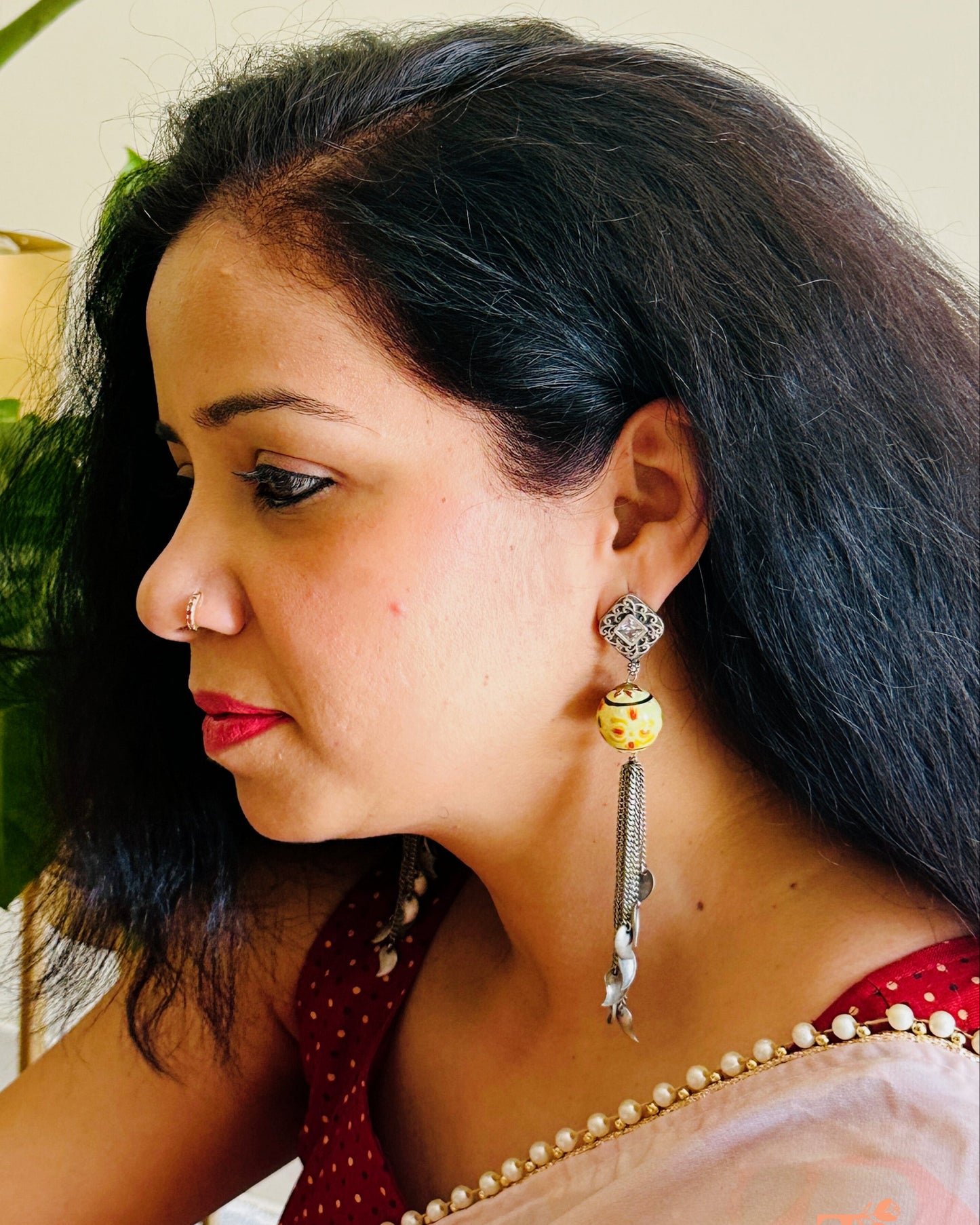 Antique oxidised earrings featuring Meenakari detailing and chain drops