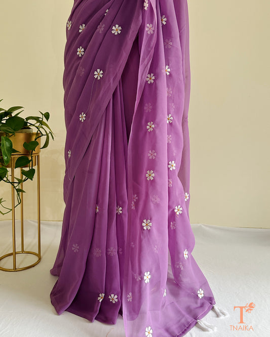 Georgette saree featuring Parijat floral motifs with blouse fabric