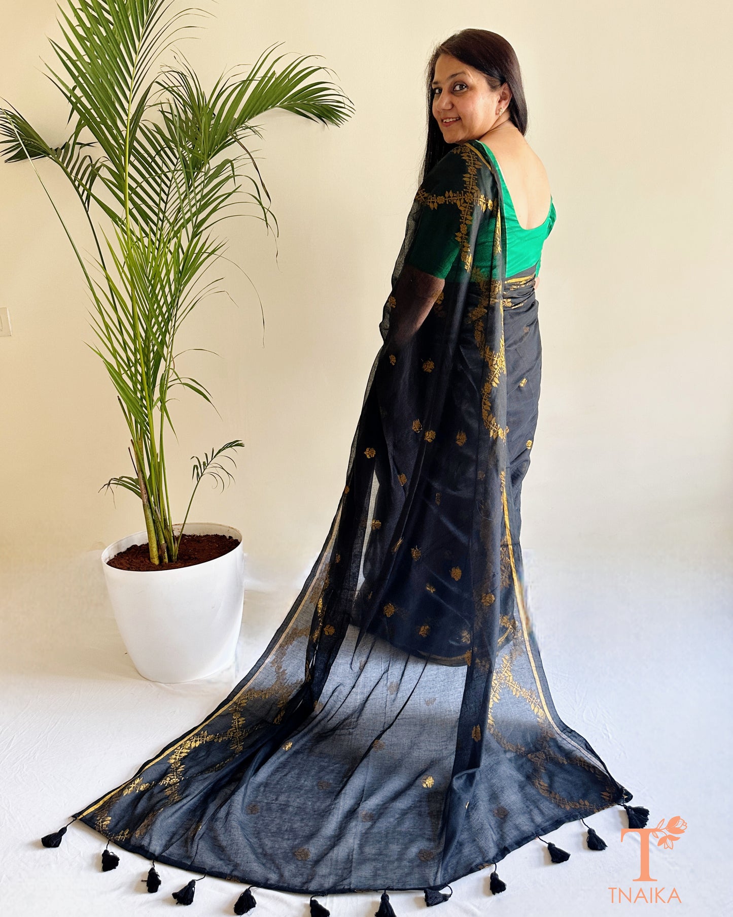 Soft mul cotton saree with textured jacquard patterns and fluid drape