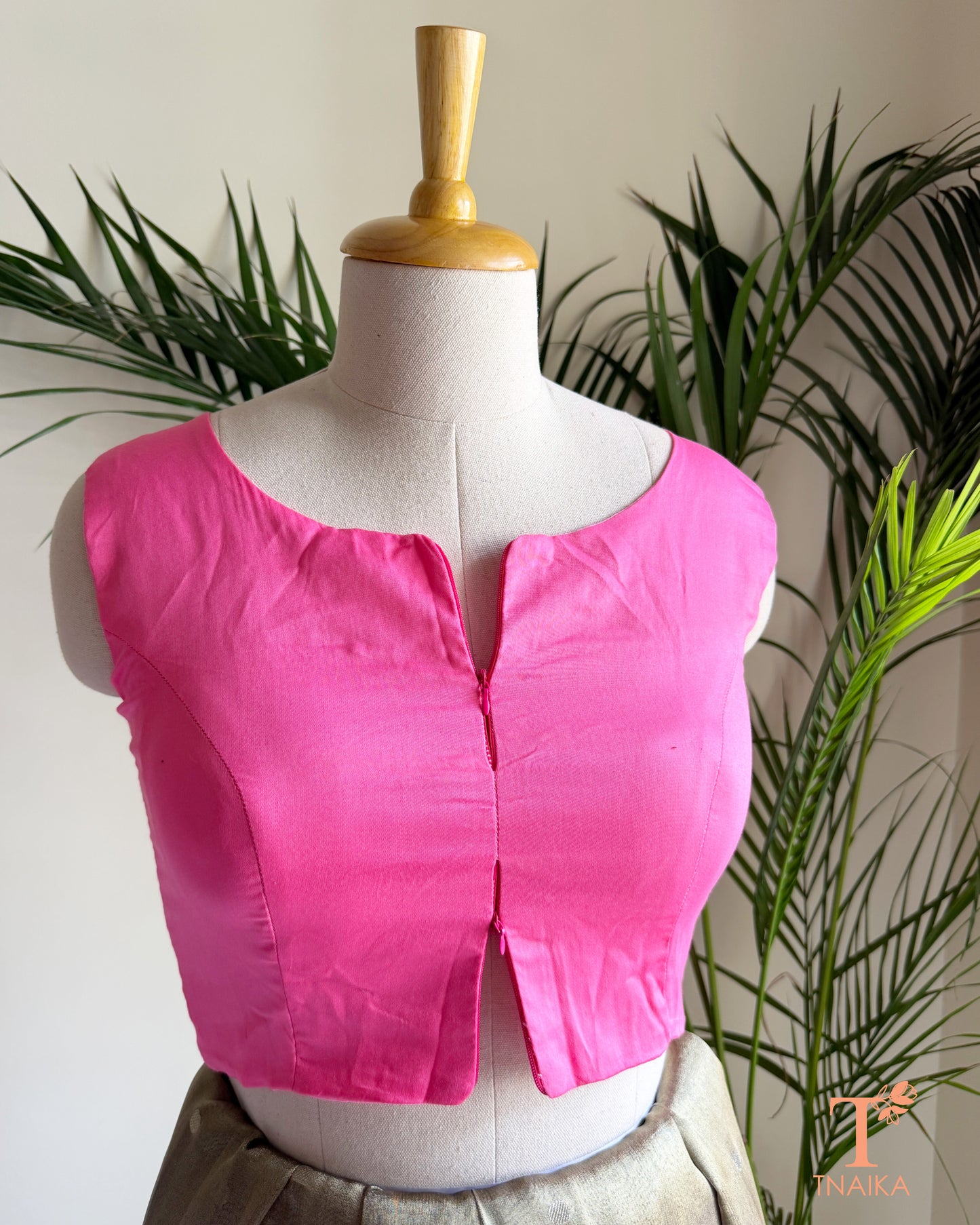 Cotton Silk sleeveless blouse featuring a modern notched round neckline and adjustable dual front zipper.