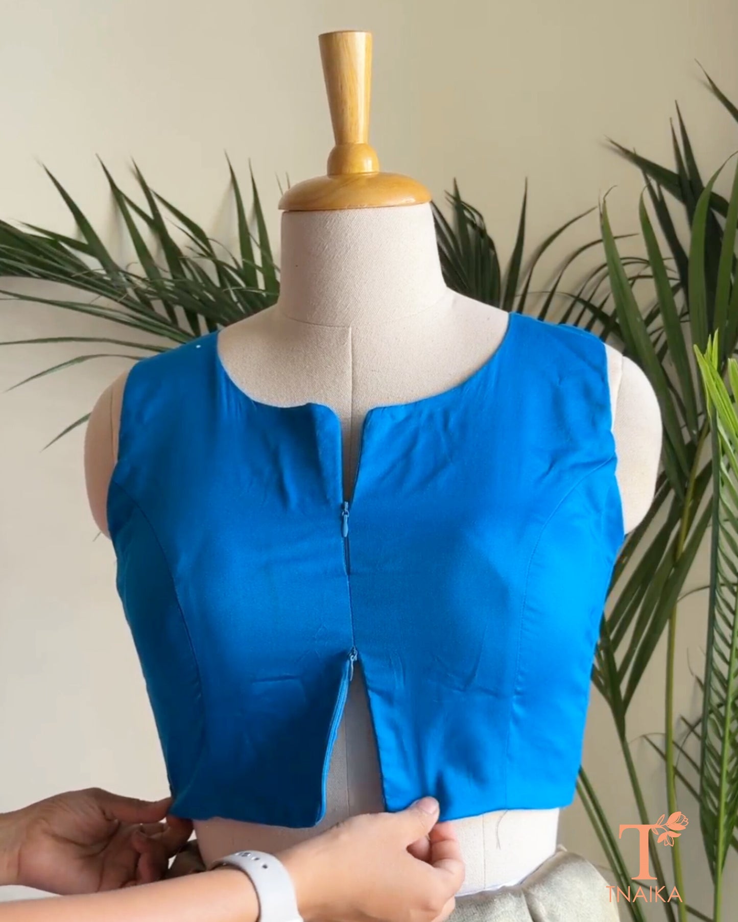 Cotton Silk sleeveless blouse featuring a modern notched round neckline and adjustable dual front zipper.