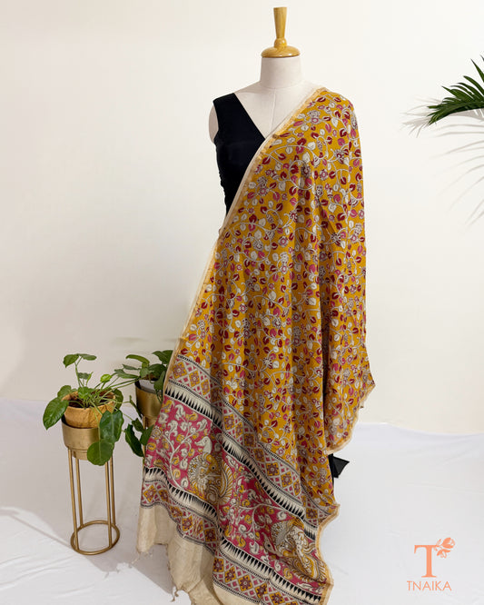 Hand block Kalamkari Nellore silk blend dupatta with fine zari border, traditional artisan prints and soft tassel detailing.