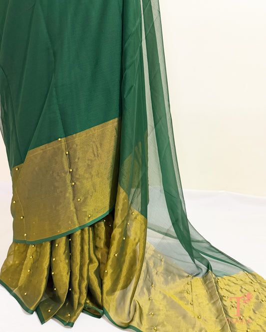 Lightweight chiffon saree with sheer pallu and tissue border.