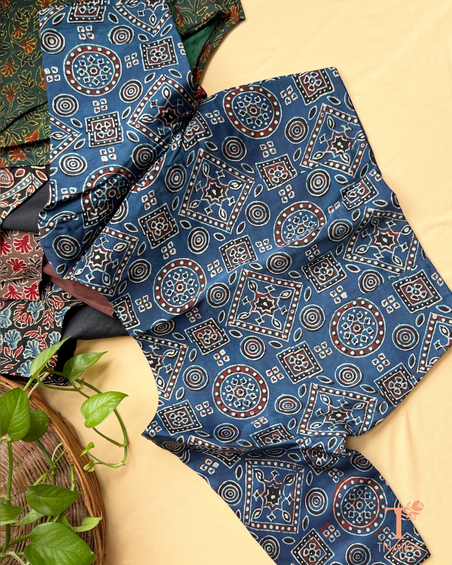 Green modal silk blouse with floral hand block print and half sleeves.