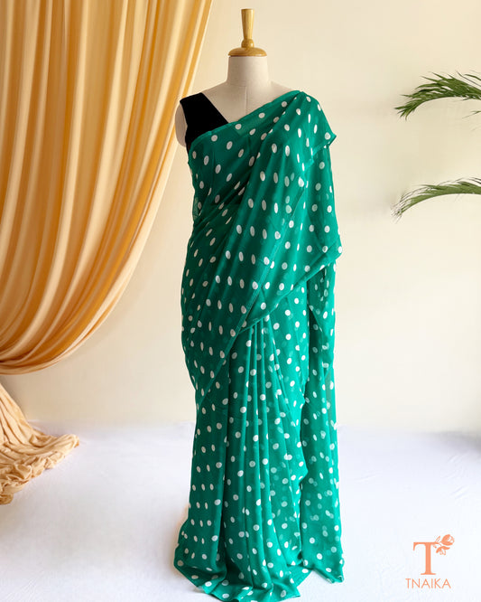 Soft flowing georgette saree with minimal polka print.