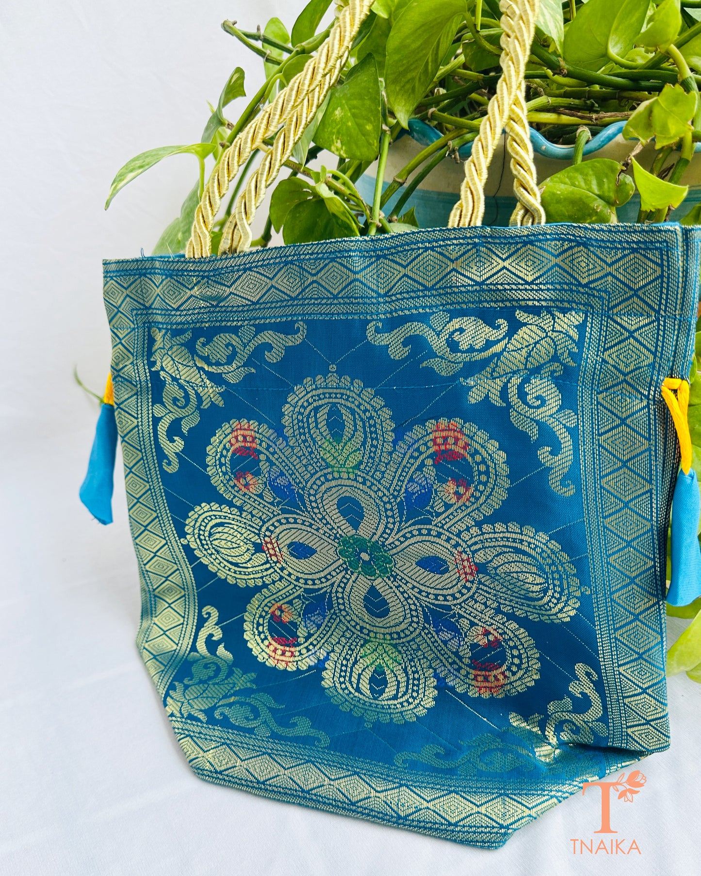 Handcrafted Banarasi brocade 2-in-1 ethnic bag with woven motifs, designed for use as both a spacious tote and an elegant potli.
