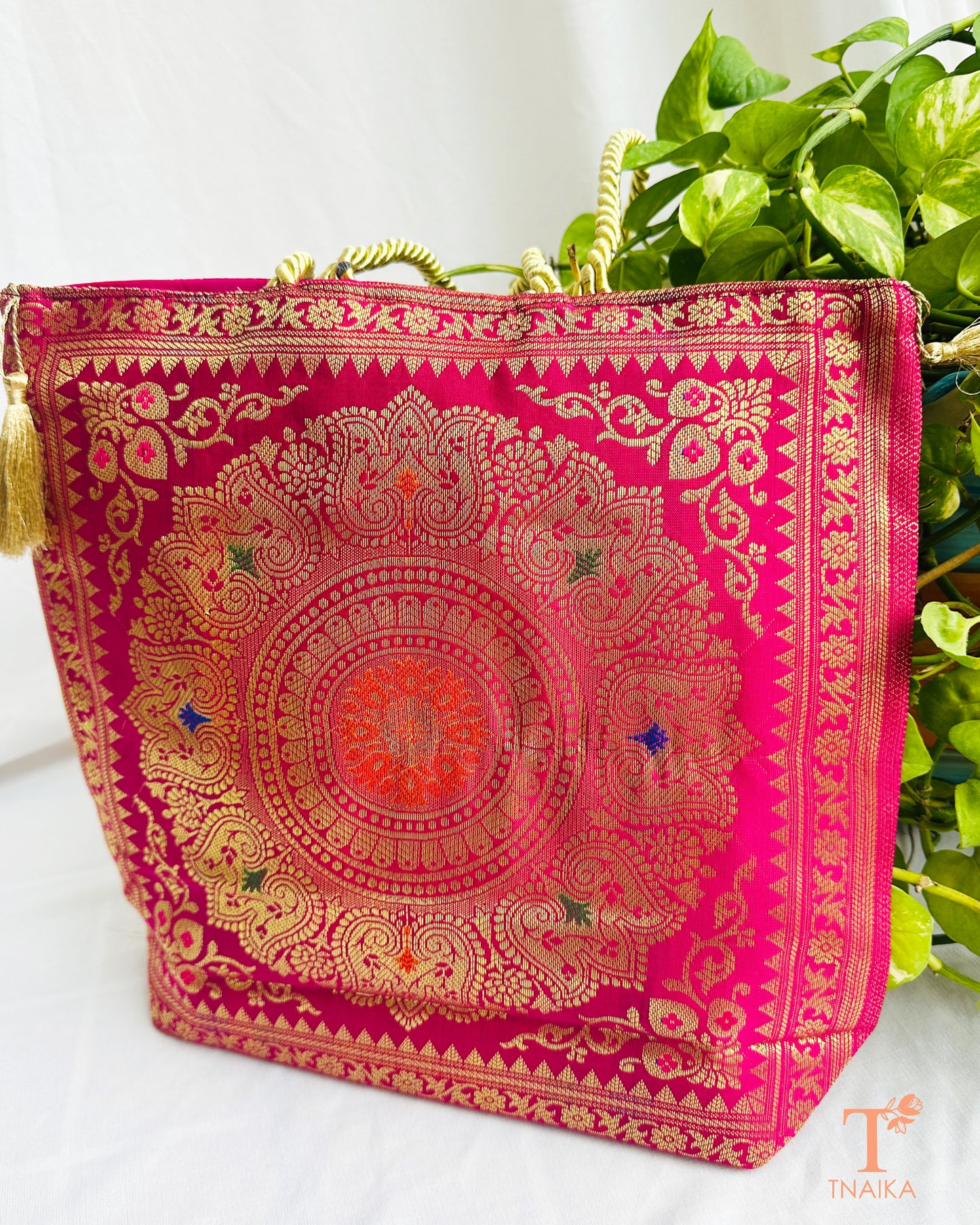 Handcrafted Banarasi bag featuring rich patterns and ethnic detailing