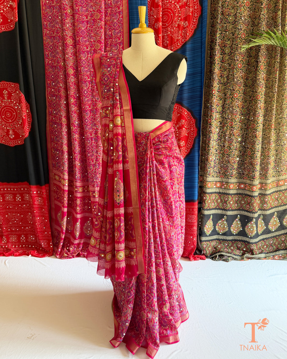 Traditional-inspired pink saree with mirror work and contrasting border