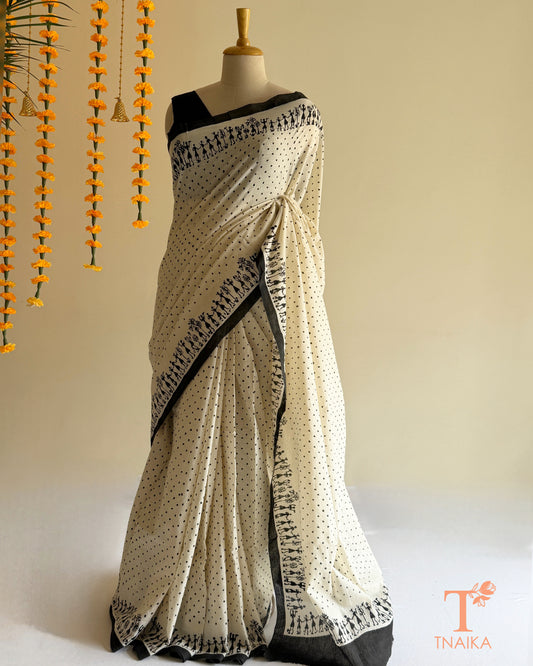 Pure Mul cotton saree with polka dot print and Warli art border