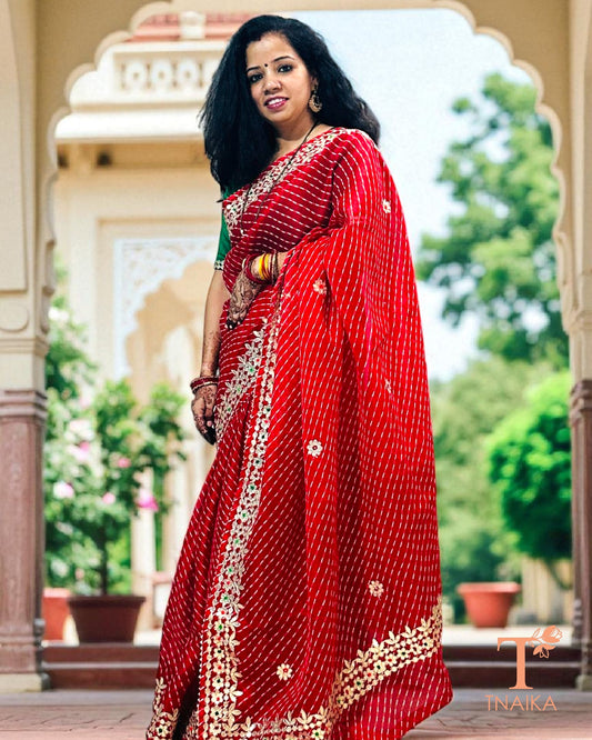 Lightweight Kota Doria saree in vibrant red with exquisite handcrafted Gotta Patti embellishments.