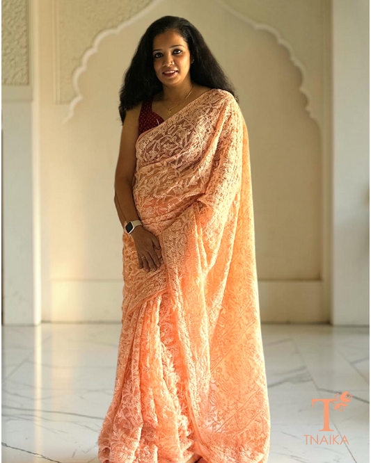 Lightweight chikankari saree with all-over jaal work in soft peach tone
