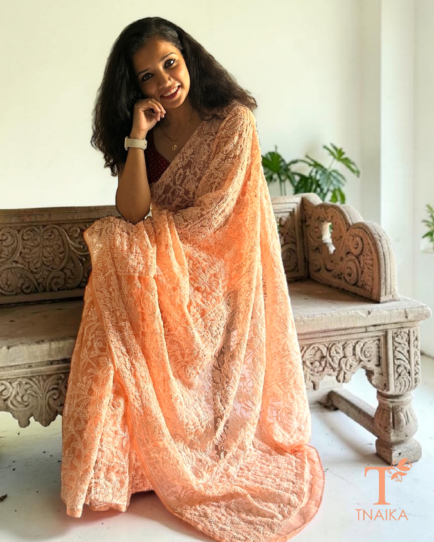 Lightweight peach chikankari saree with intricate thread embroidery detailing