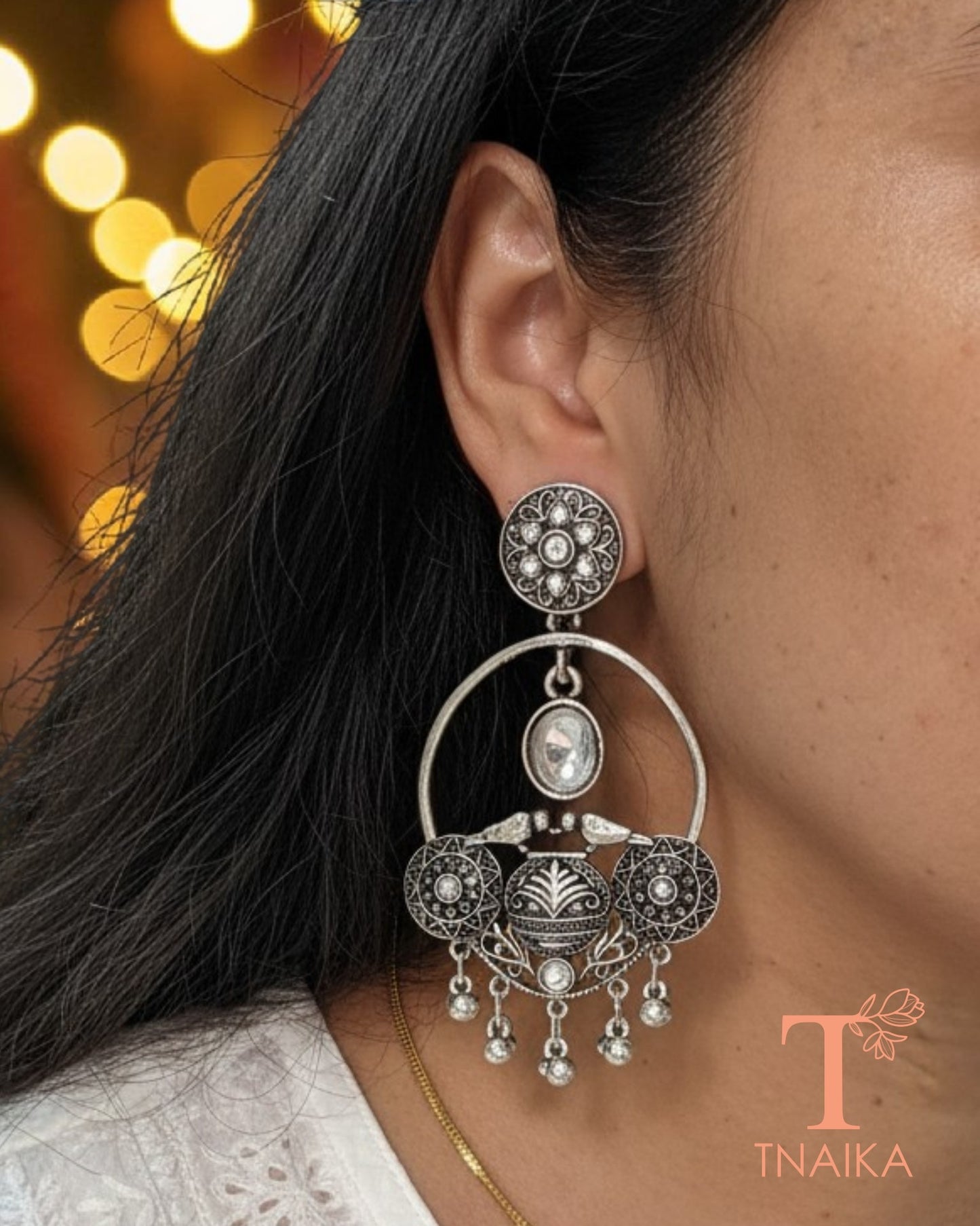 Oxidised silver tone earrings with stone work and intricate ethnic 