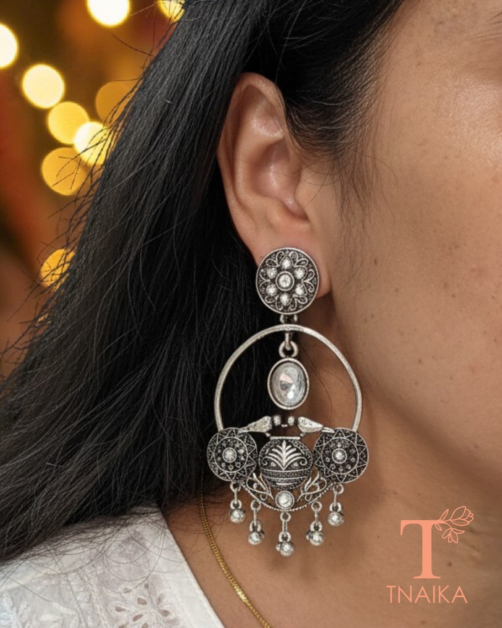 Oxidised silver tone earrings with stone work and intricate ethnic 