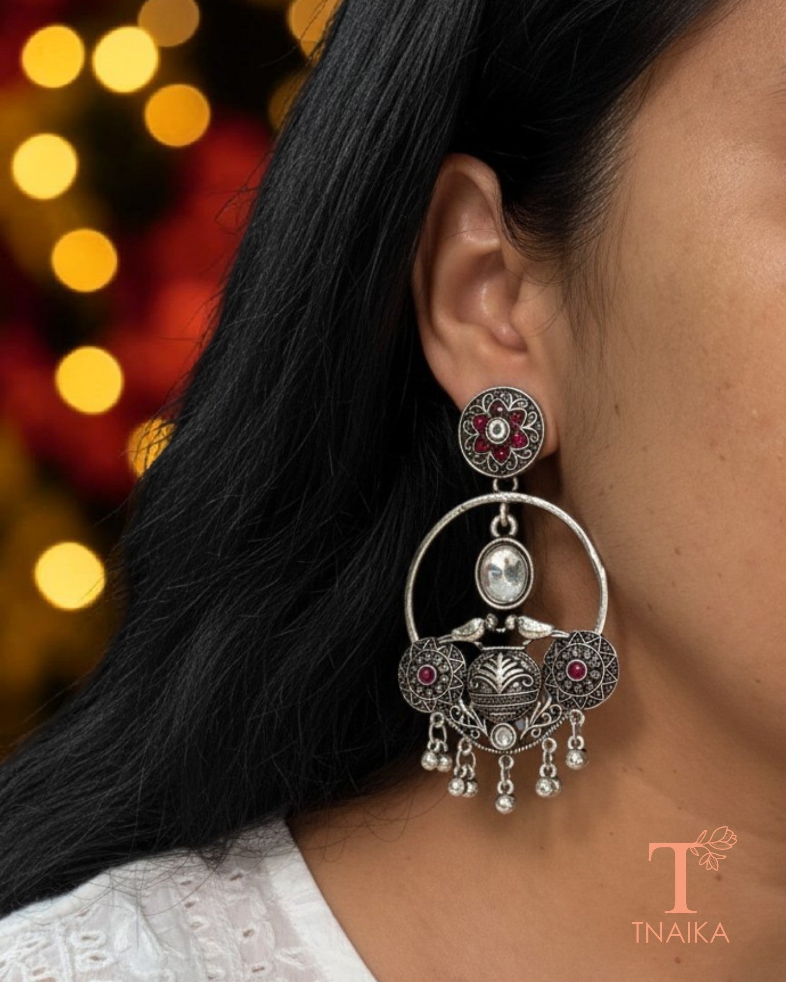 Oxidised silver tone earrings with stone work and intricate ethnic 
