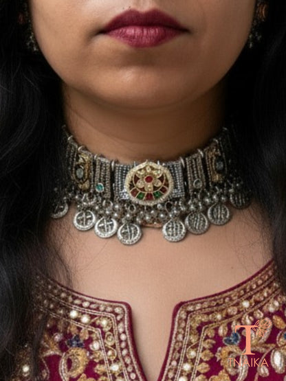 Matching oxidised stud earrings with kundan teardrop stones and ghungroo detailing from the Rajsi Kundan Virasat choker jewellery set.