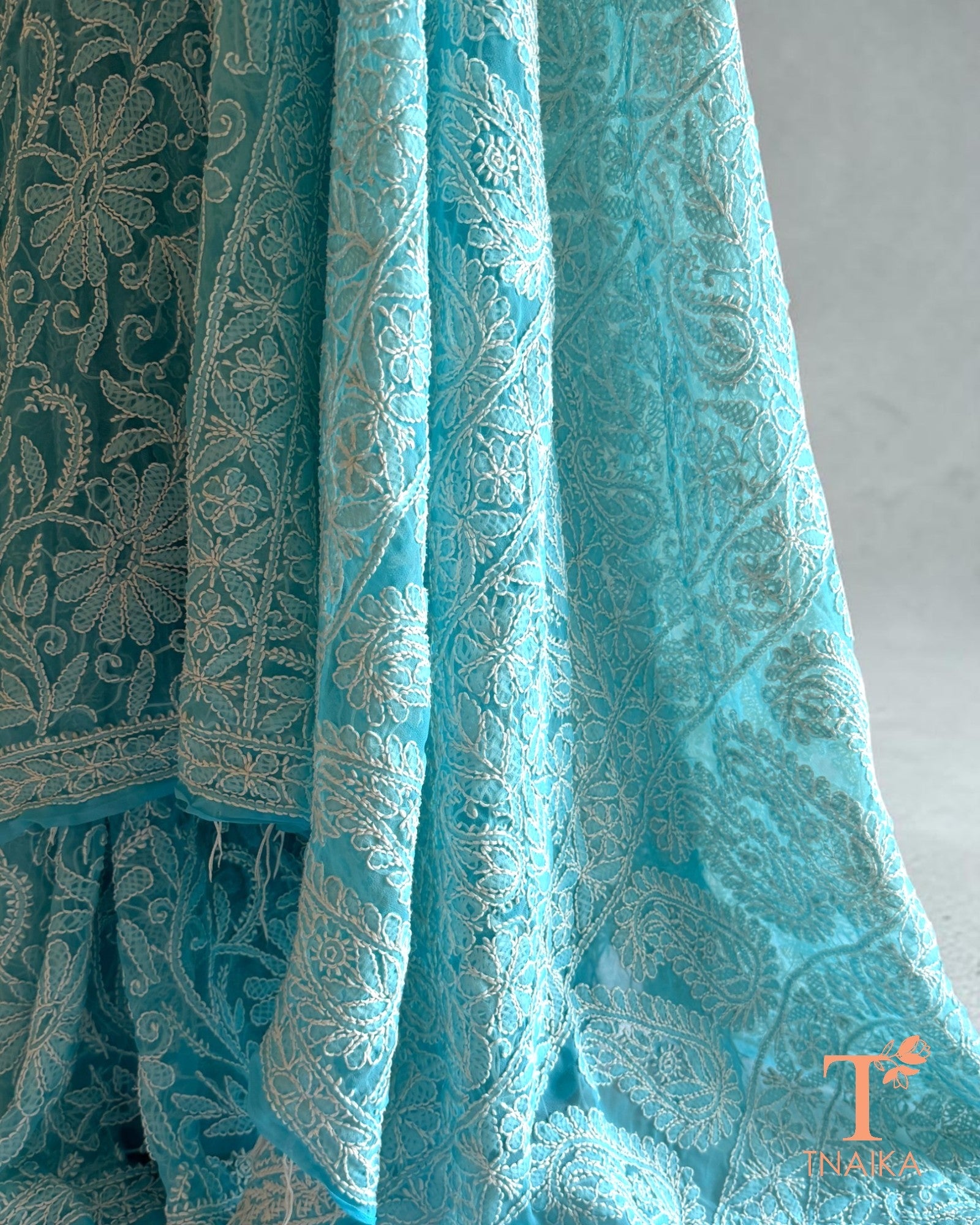 Aqua blue Lucknowi Chikankari saree with intricate white embroidery