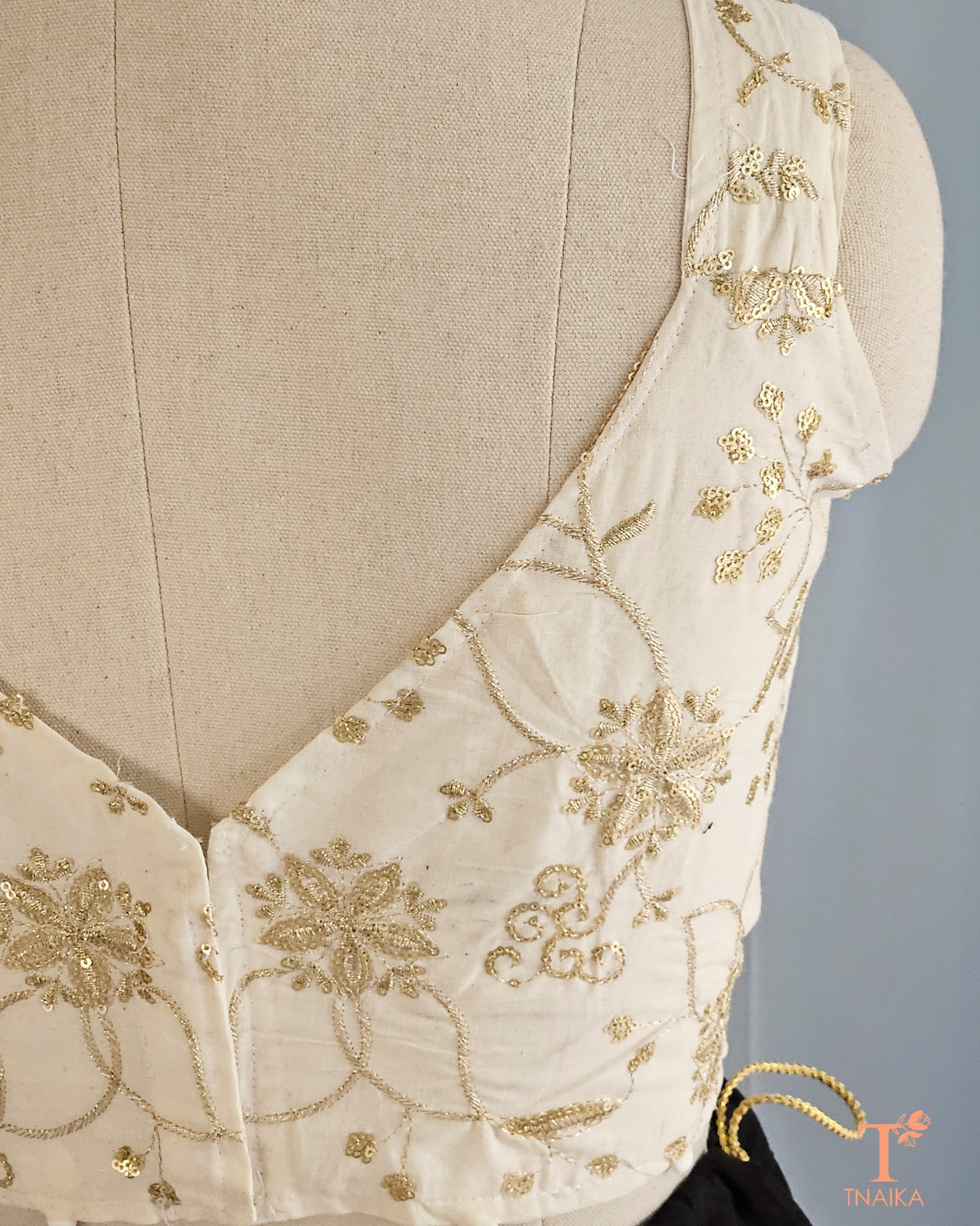 Hand-embroidered golden blouse
Wedding wear blouse designs
Golden zari embroidery blouse
Off-white festive blouse
Blouse with golden floral embroidery
Stylish golden blouse
Off-white blouse for lehenga
Classic golden embroidered blouse
Golden blouse for special occasions
Off-white blouse with intricate embroidery
Golden detailing blouse
Ethnic wear blouse with embroidery