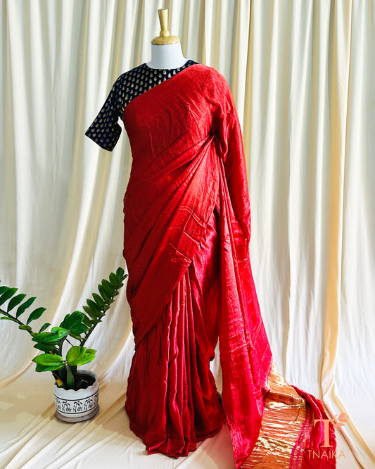 Plain modal silk saree with soft texture and natural sheen, draped gracefully for an elegant look