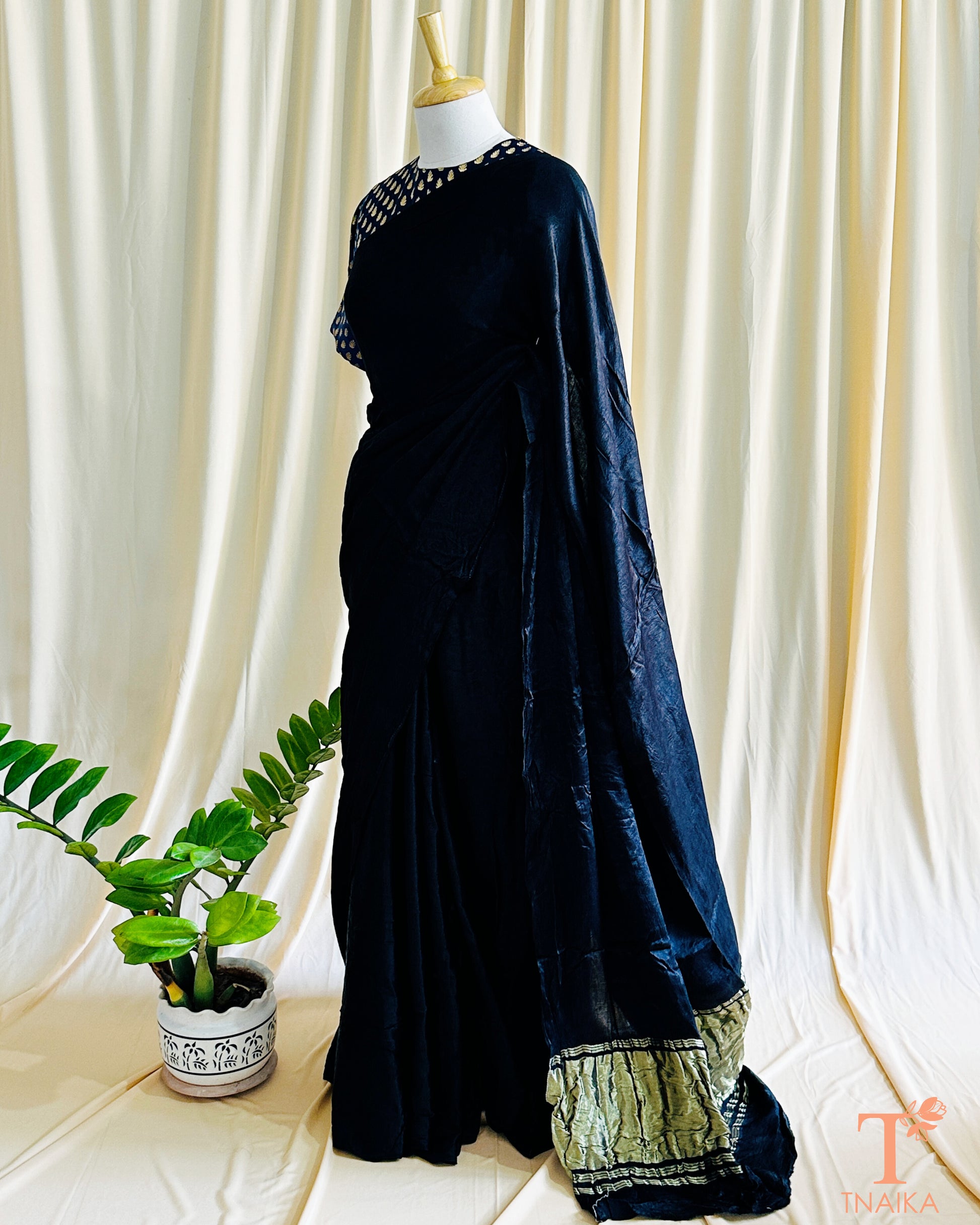 Minimalist plain black modal silk saree suitable for formal and festive wear