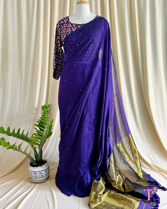 Golden tissue weaved pallu saree with foil tikki work and regal tassels