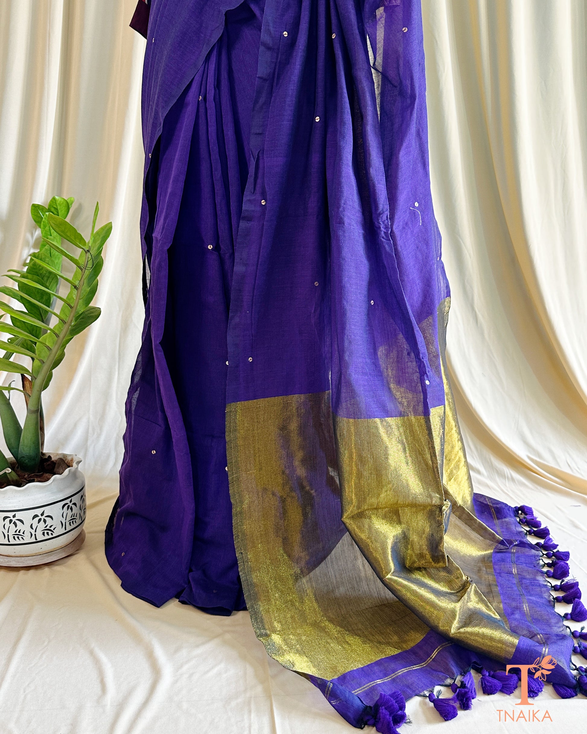 Traditional cotton saree with shimmering foil accents and rich golden pallu