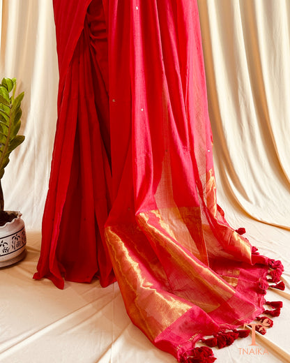 Soft cotton saree featuring a bold brown border on black fabric, ideal for cultural and everyday occasions