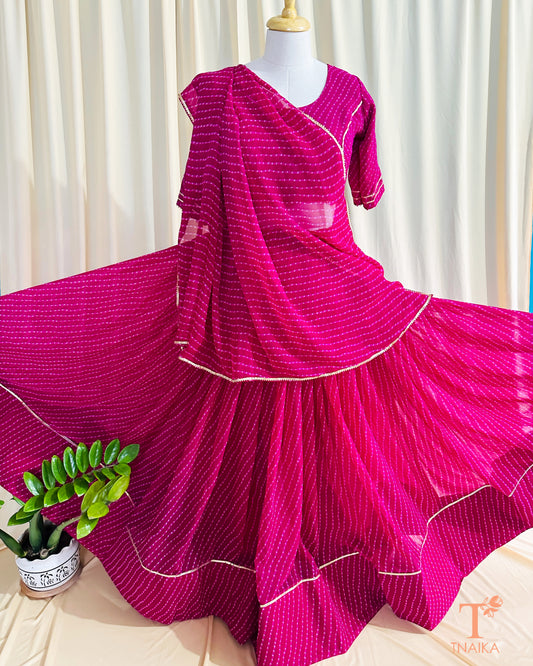 Flowy georgette Leheriya lehenga set with delicate lace work, paired with matching blouse and dupatta