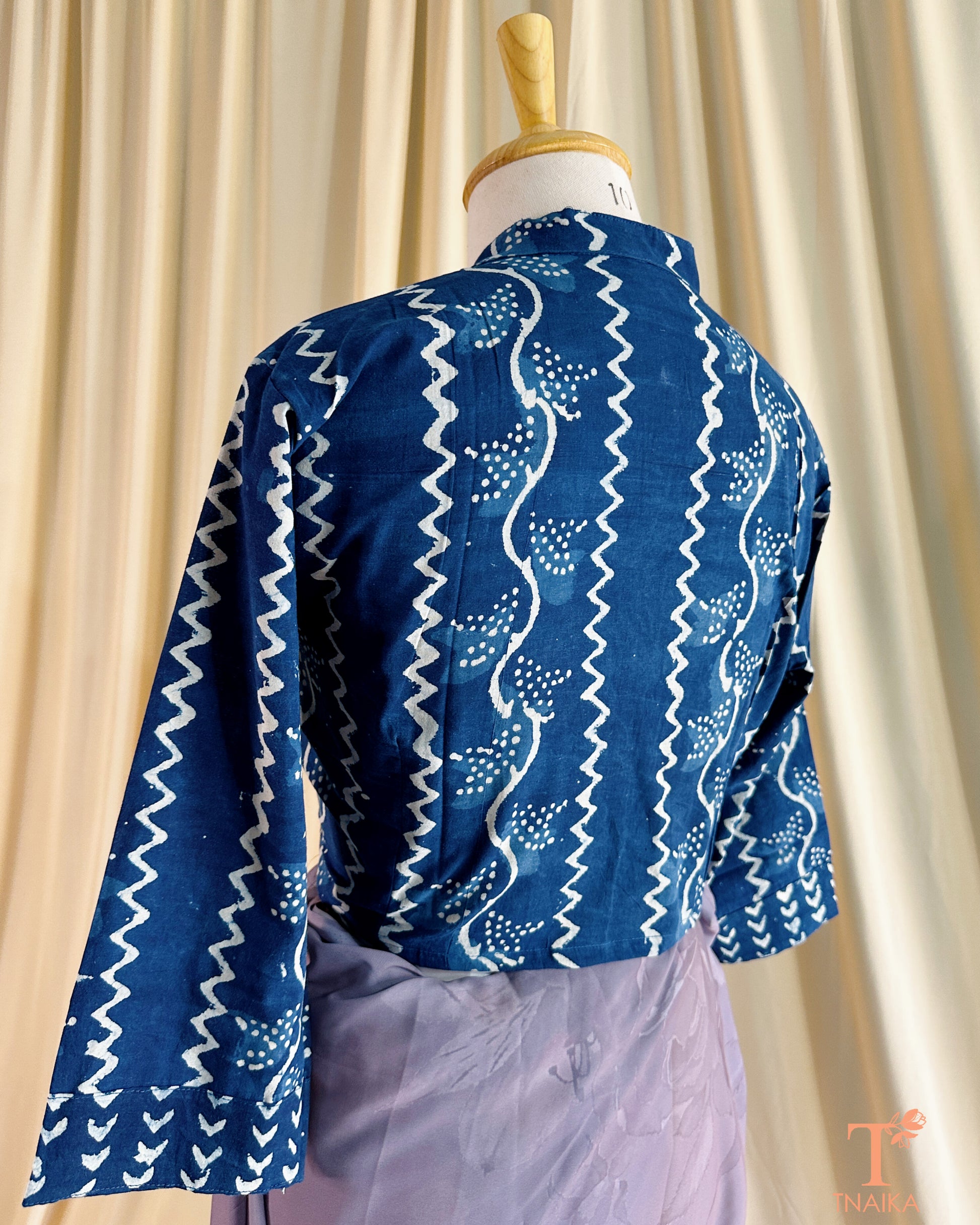 Handcrafted cotton blouse with Nehru collar, block prints, and front buttons.