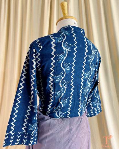 Handcrafted cotton blouse with Nehru collar, block prints, and front buttons.