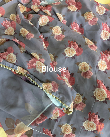 Lightweight floral georgette saree featuring pearl lace detailing for festive wear.