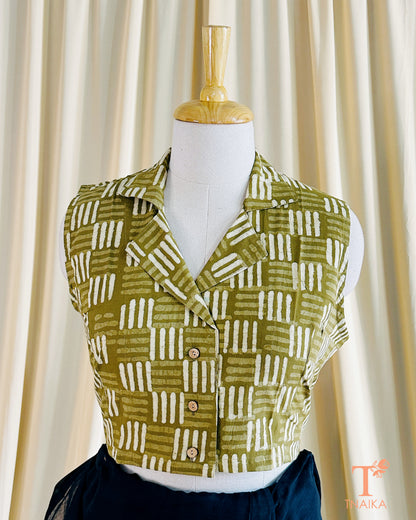 Mehendi green cotton blouse with front opening and handcrafted detailing.