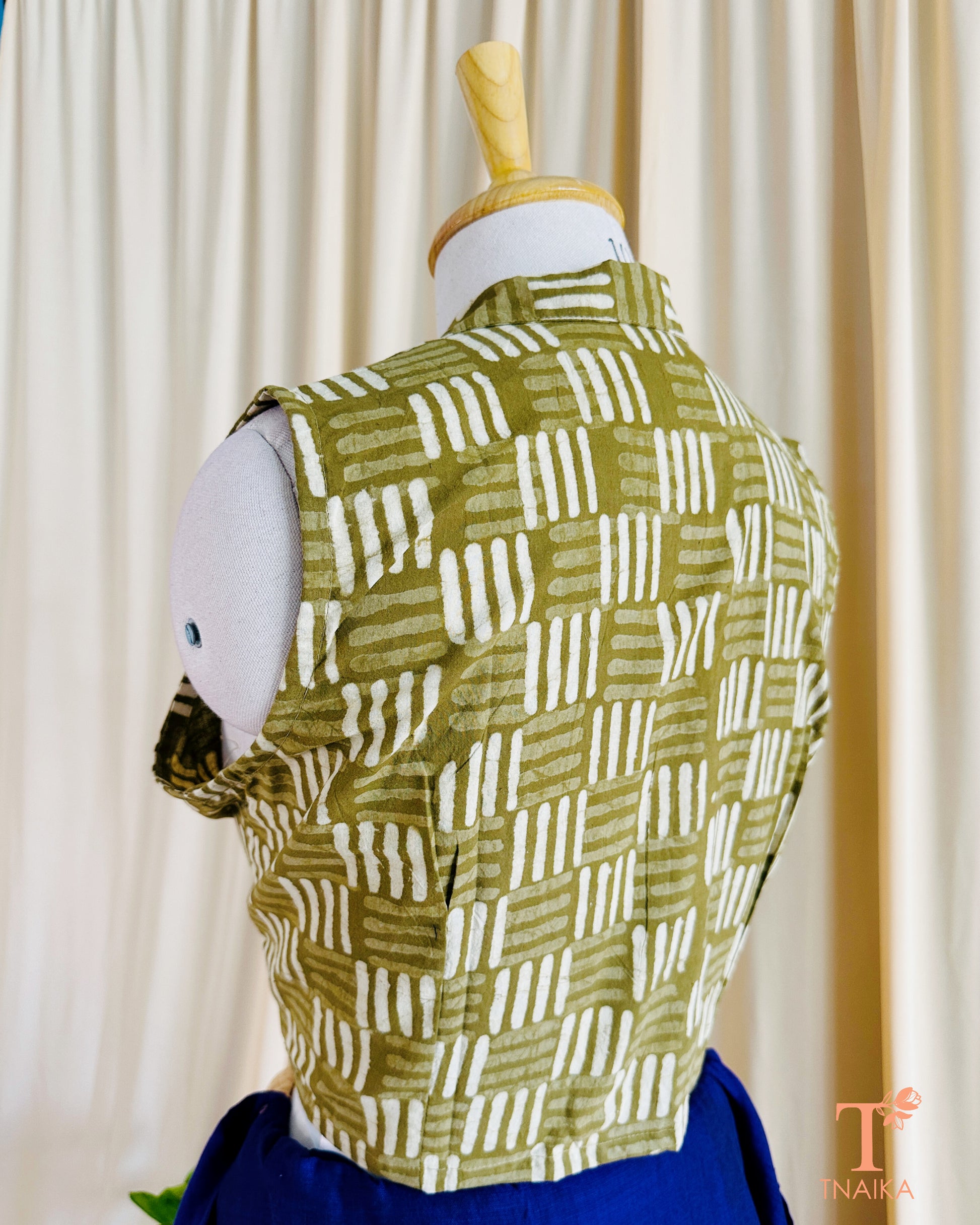 Handcrafted mehendi green blouse featuring soft fabric and stylish finish.