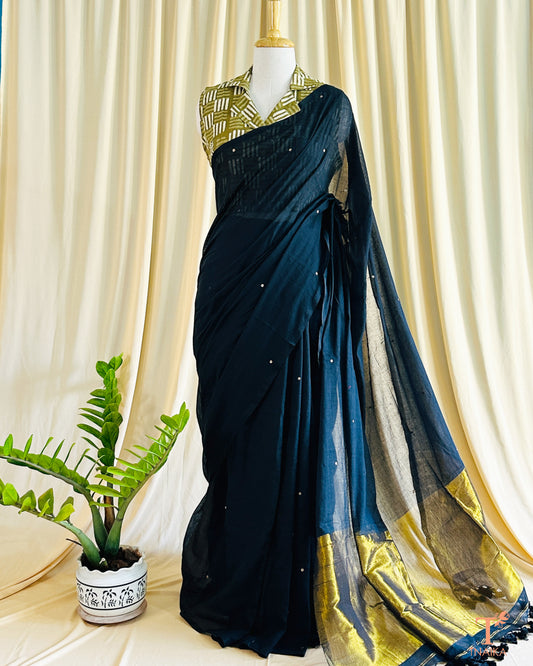 Cotton saree with delicate foil tikki work and golden tissue pallu.