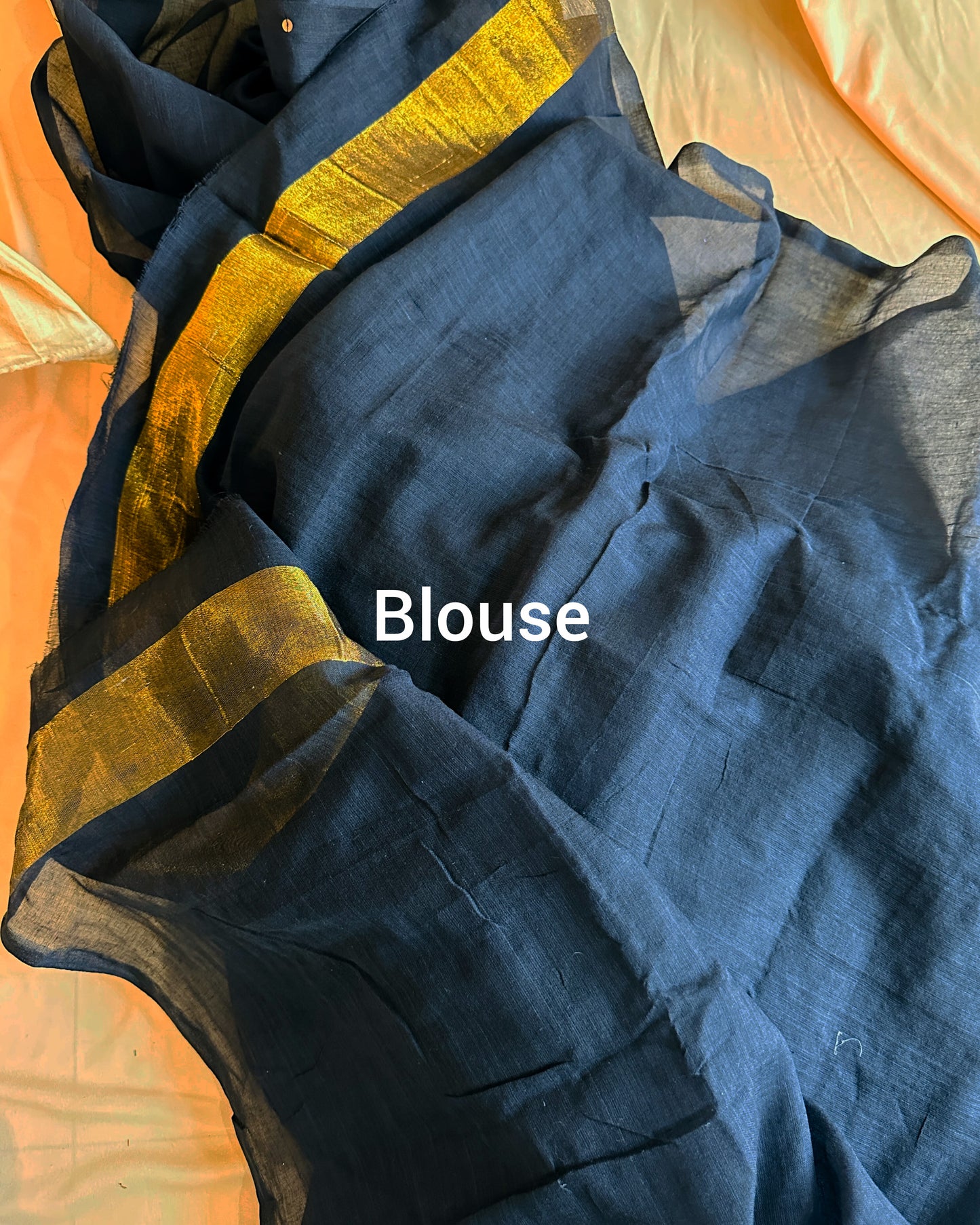 Cotton saree with golden tissue weave pallu and unstitched running blouse.