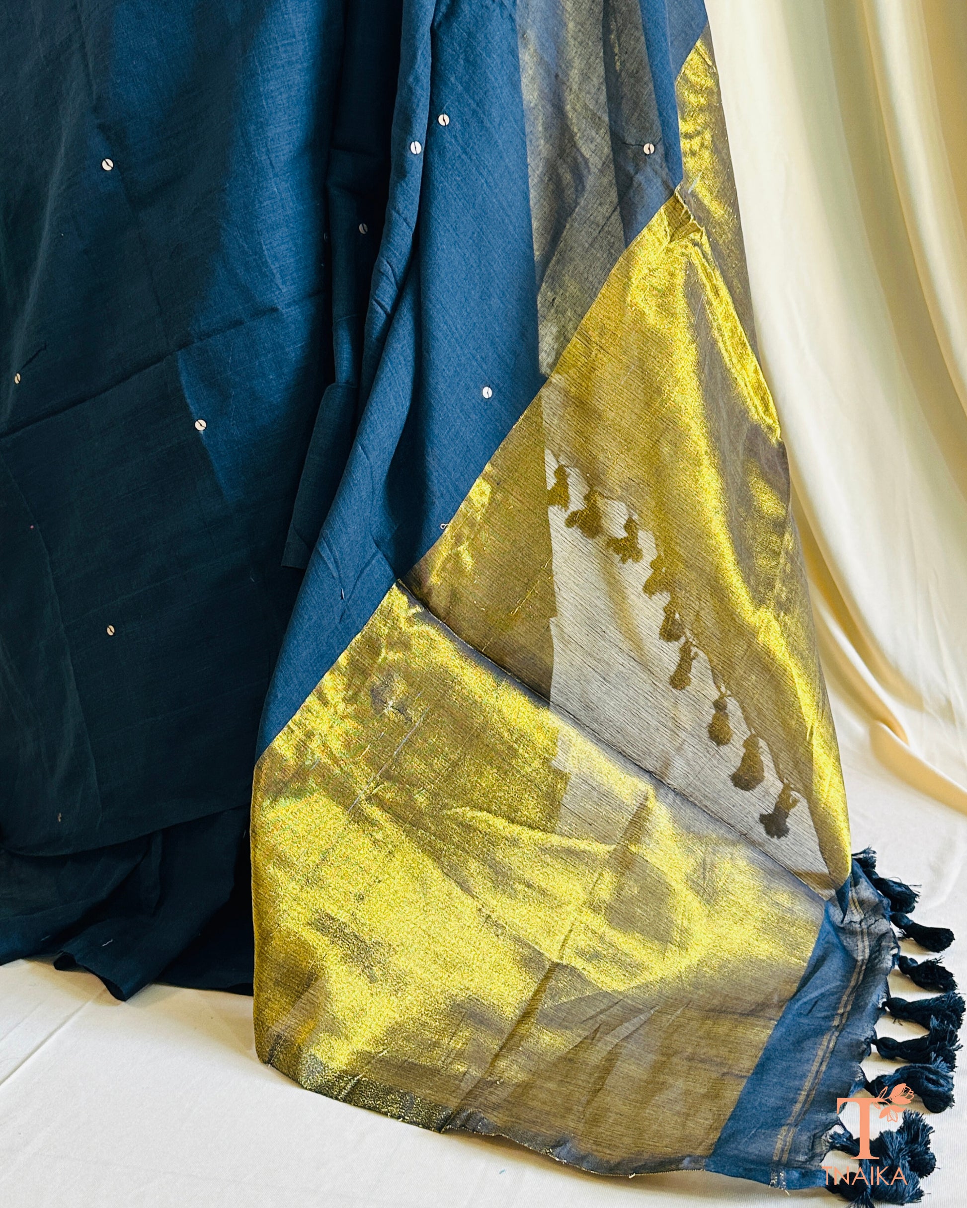 Cotton saree with golden tissue weave pallu and unstitched running blouse.