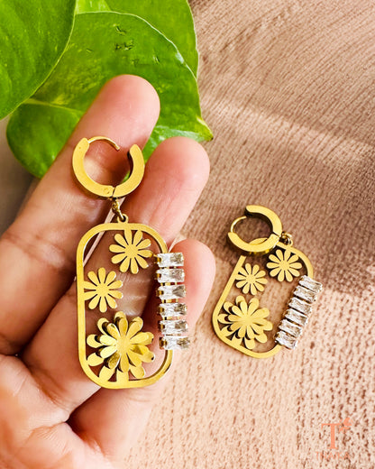 Anti-tarnish stainless steel earrings featuring floral cut-out design and zirconia bar