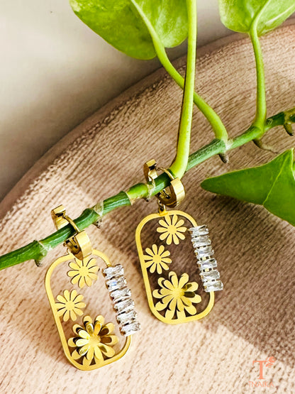 Gold floral frame earrings with baguette zirconia detailing